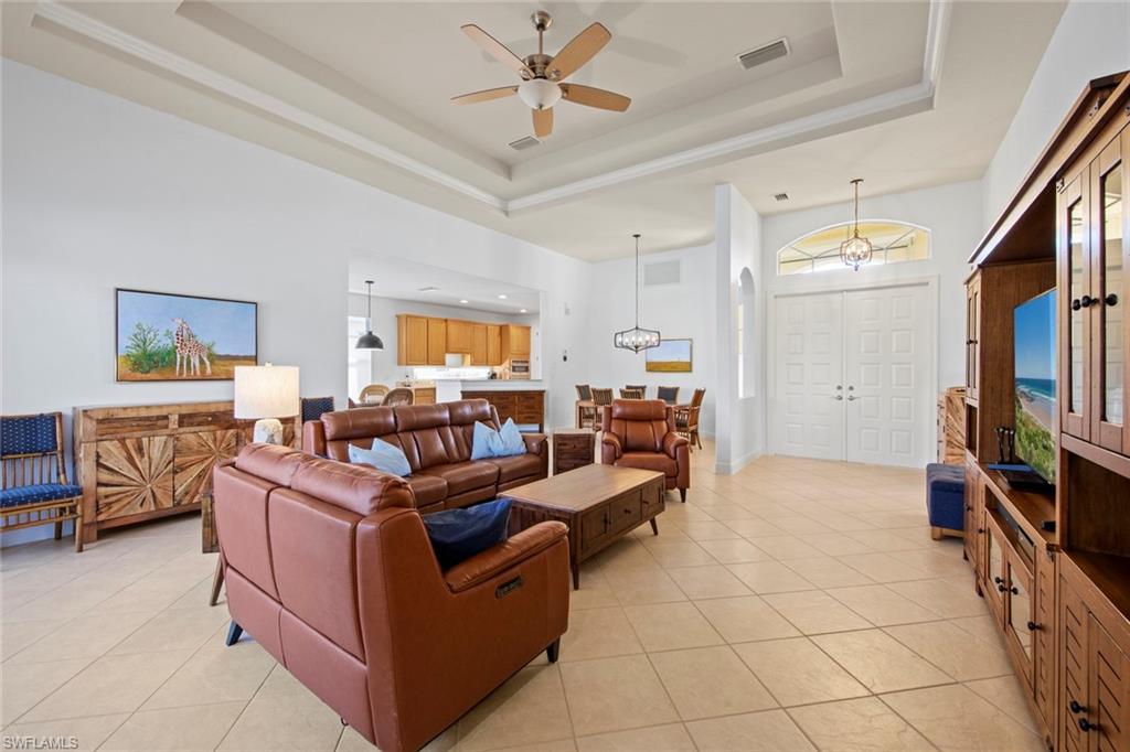 19924 Maddelena Circle Estero, FL 33967 - Photo 11 of 35 a living room with furniture and a flat screen tv