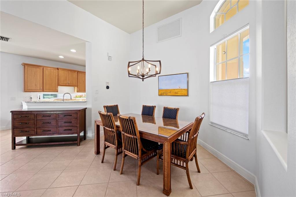 19924 Maddelena Circle Estero, FL 33967 - Photo 14 of 35 a dining room with furniture and window