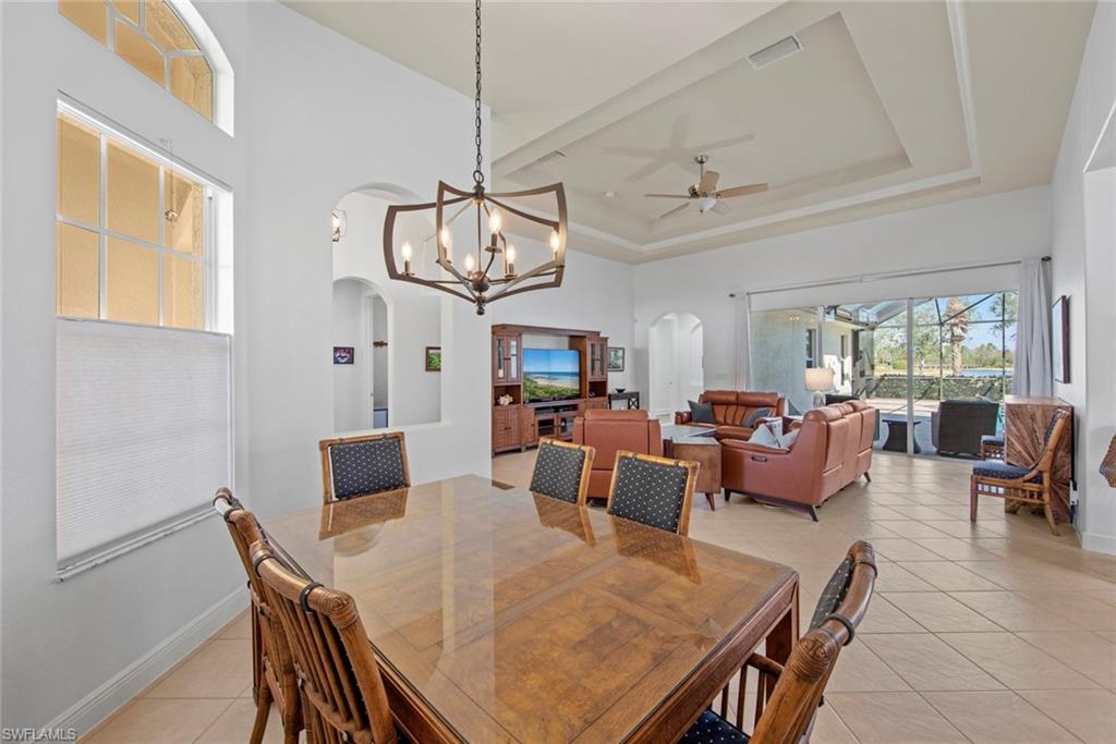19924 Maddelena Circle Estero, FL 33967 - Photo 15 of 35 a view of a dining room with furniture window and outside view