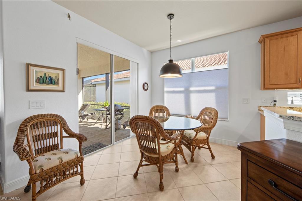 19924 Maddelena Circle Estero, FL 33967 - Photo 16 of 35 a dining room with furniture and window