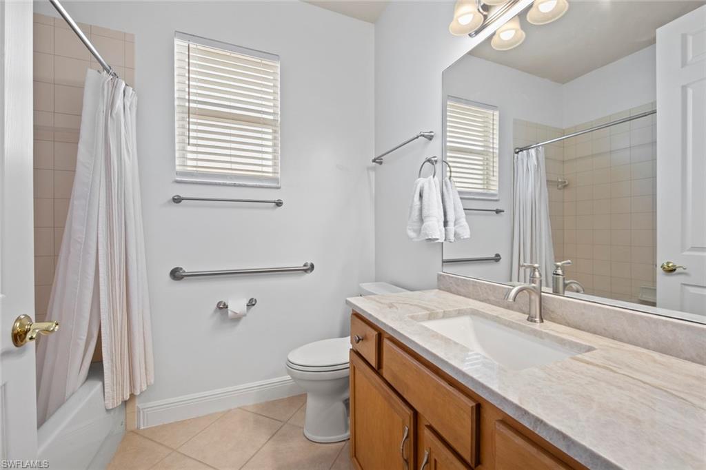 19924 Maddelena Circle Estero, FL 33967 - Photo 24 of 35 a bathroom with a granite countertop sink toilet and shower