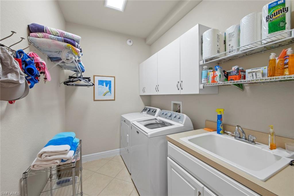 19924 Maddelena Circle Estero, FL 33967 - Photo 31 of 35 a utility room with sink dryer and washer