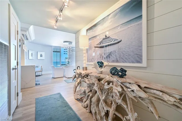 a bedroom with furniture and a large window