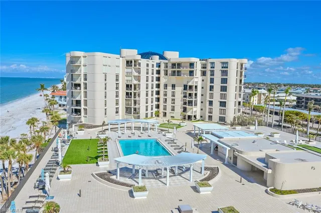 a view of a patio with a table and chairs