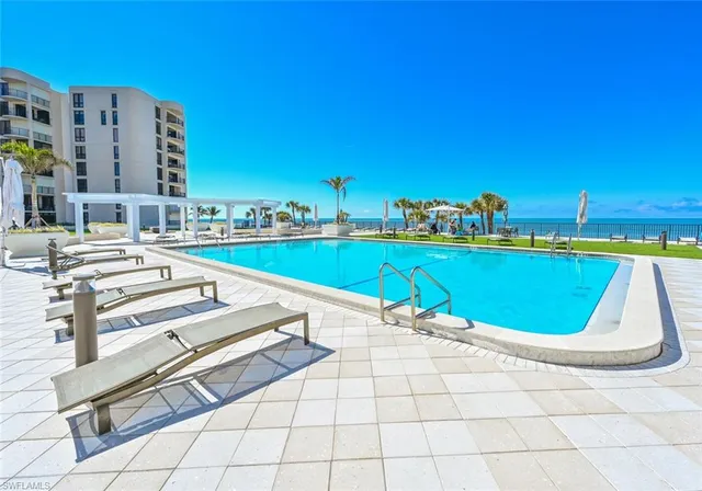 a view of a patio with a table and chairs