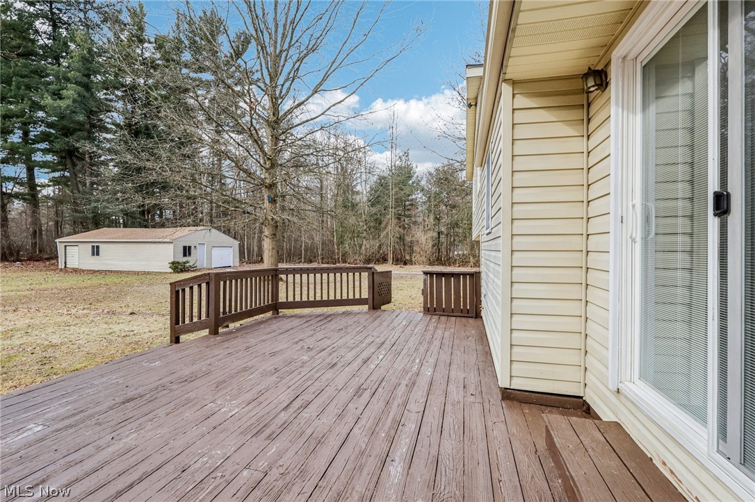 2829 Tibbetts Wick Road Hubbard, OH 44425 - Photo 31 of 44 Wooden deck with an outbuilding, a yard, and view of scattered trees