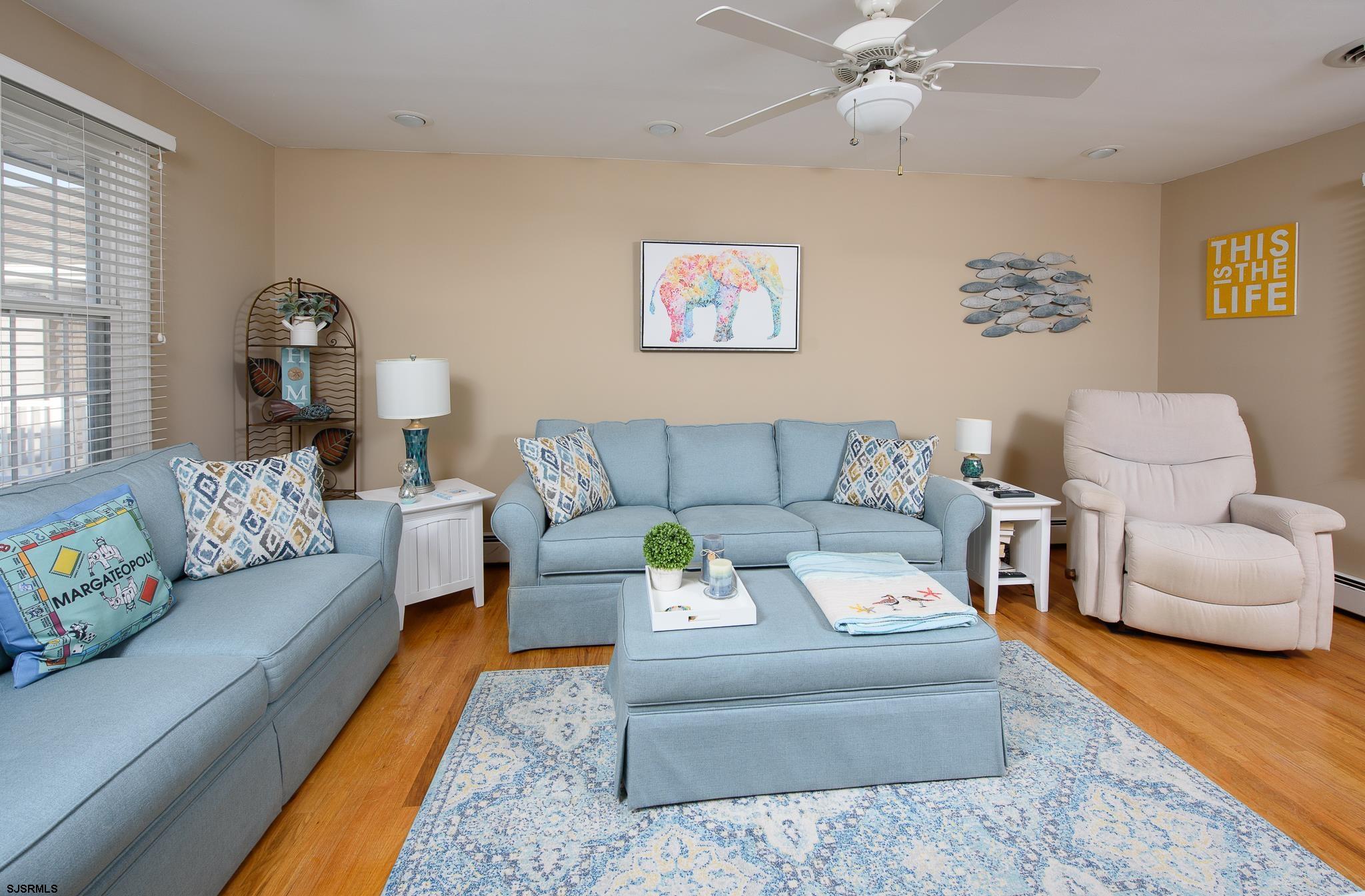 7 South Franklin Avenue, Unit 7 Margate City, NJ 08402 - Photo 1 of 16 a living room with furniture and a couch
