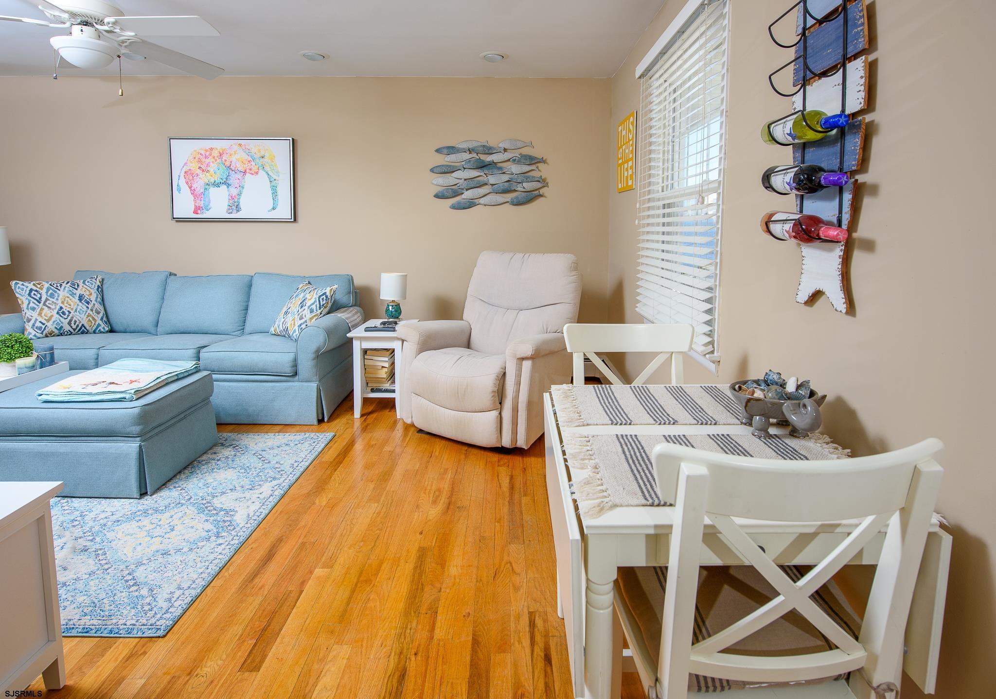 7 South Franklin Avenue, Unit 7 Margate City, NJ 08402 - Photo 6 of 16 a living room with furniture and a rug