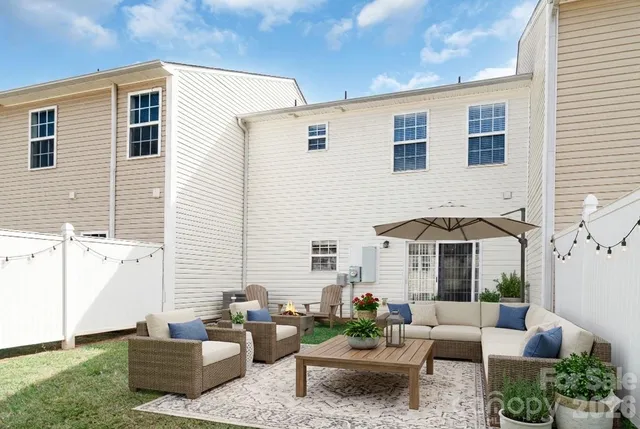a view of a house with outdoor space and sitting area