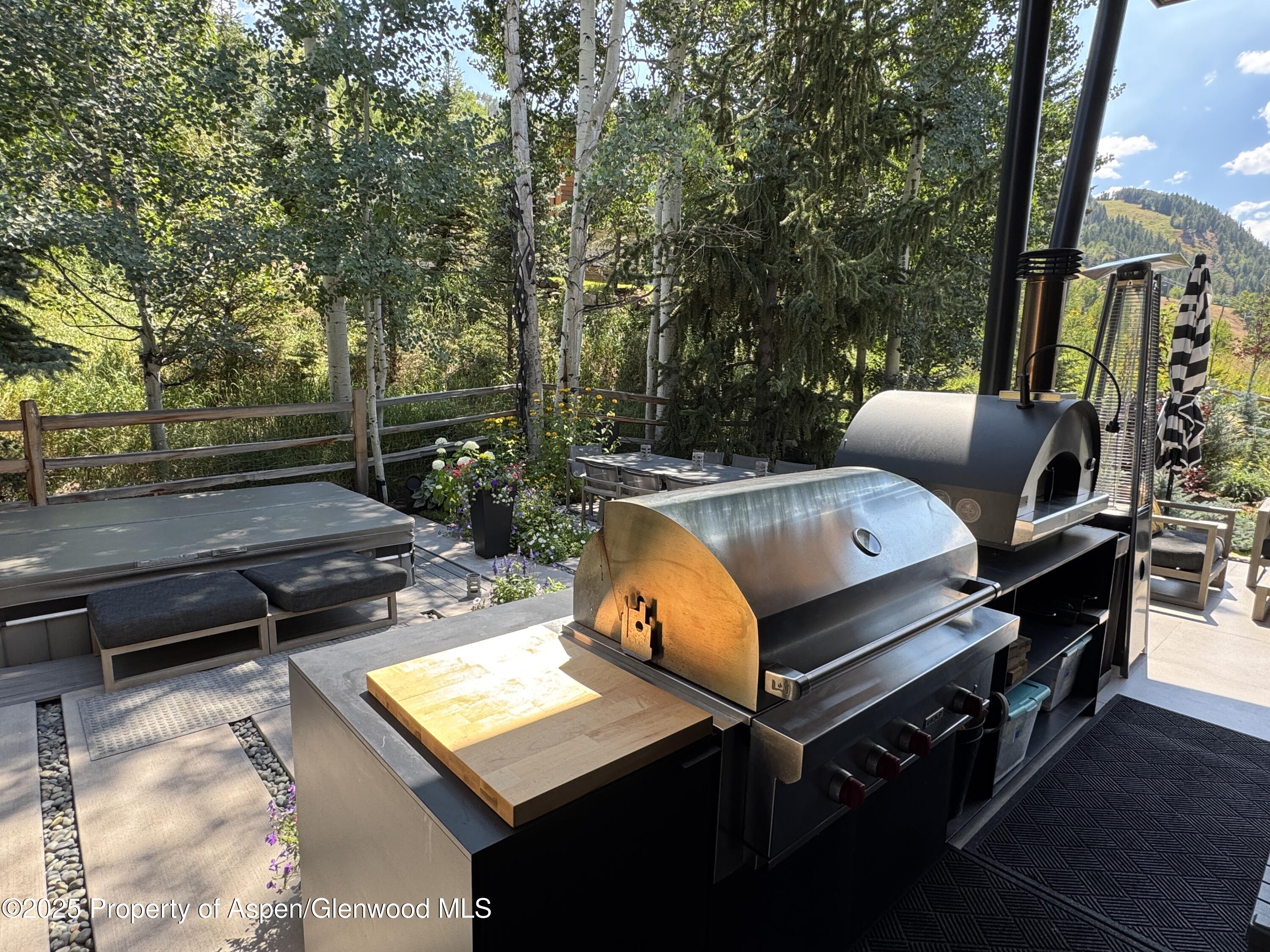 296 Glen Dee Road Aspen, CO 81611 - Photo 21 of 25 a view of a roof deck with couches and wooden floor