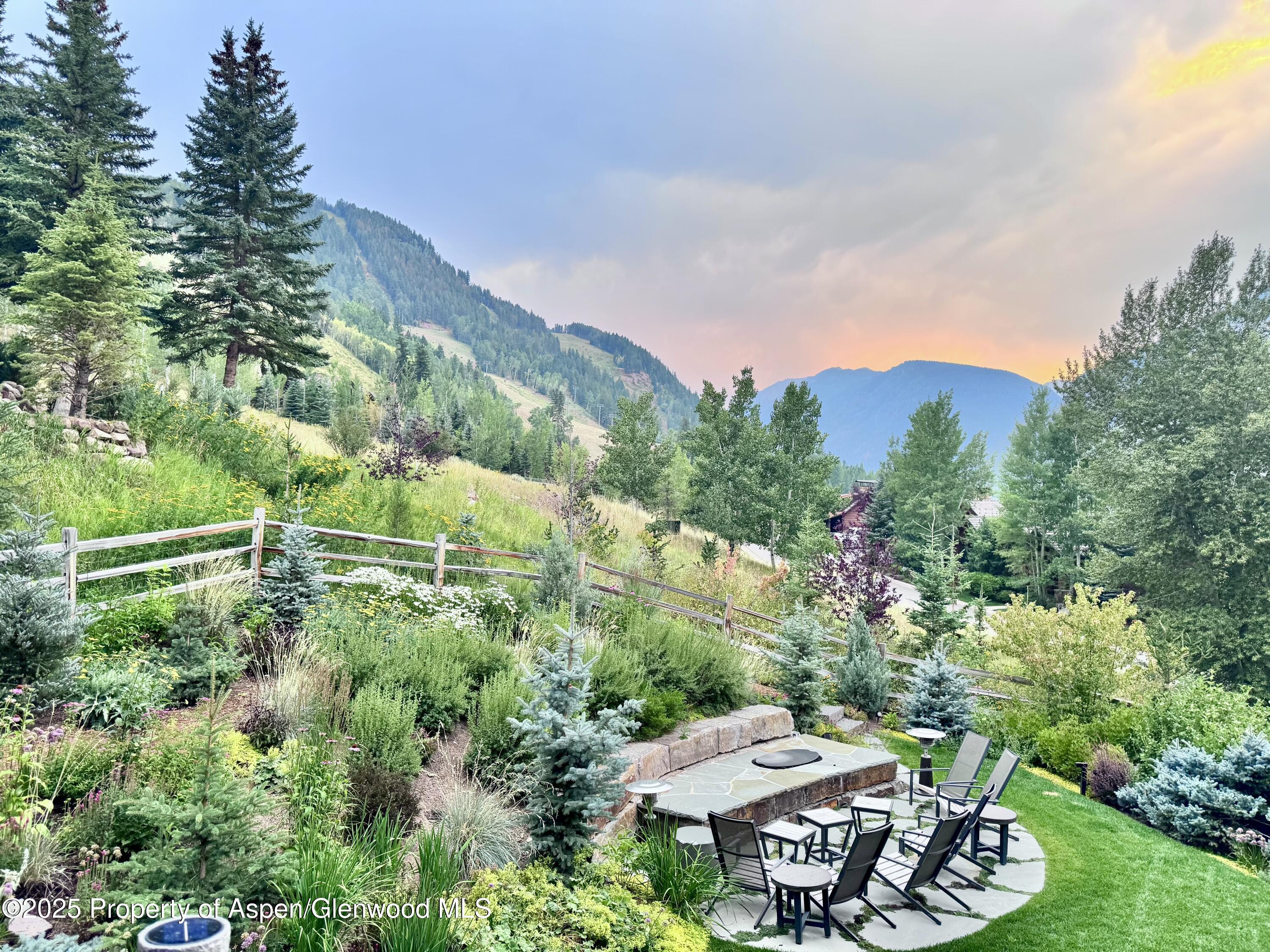 296 Glen Dee Road Aspen, CO 81611 - Photo 25 of 25 a view of a table and chairs in backyard
