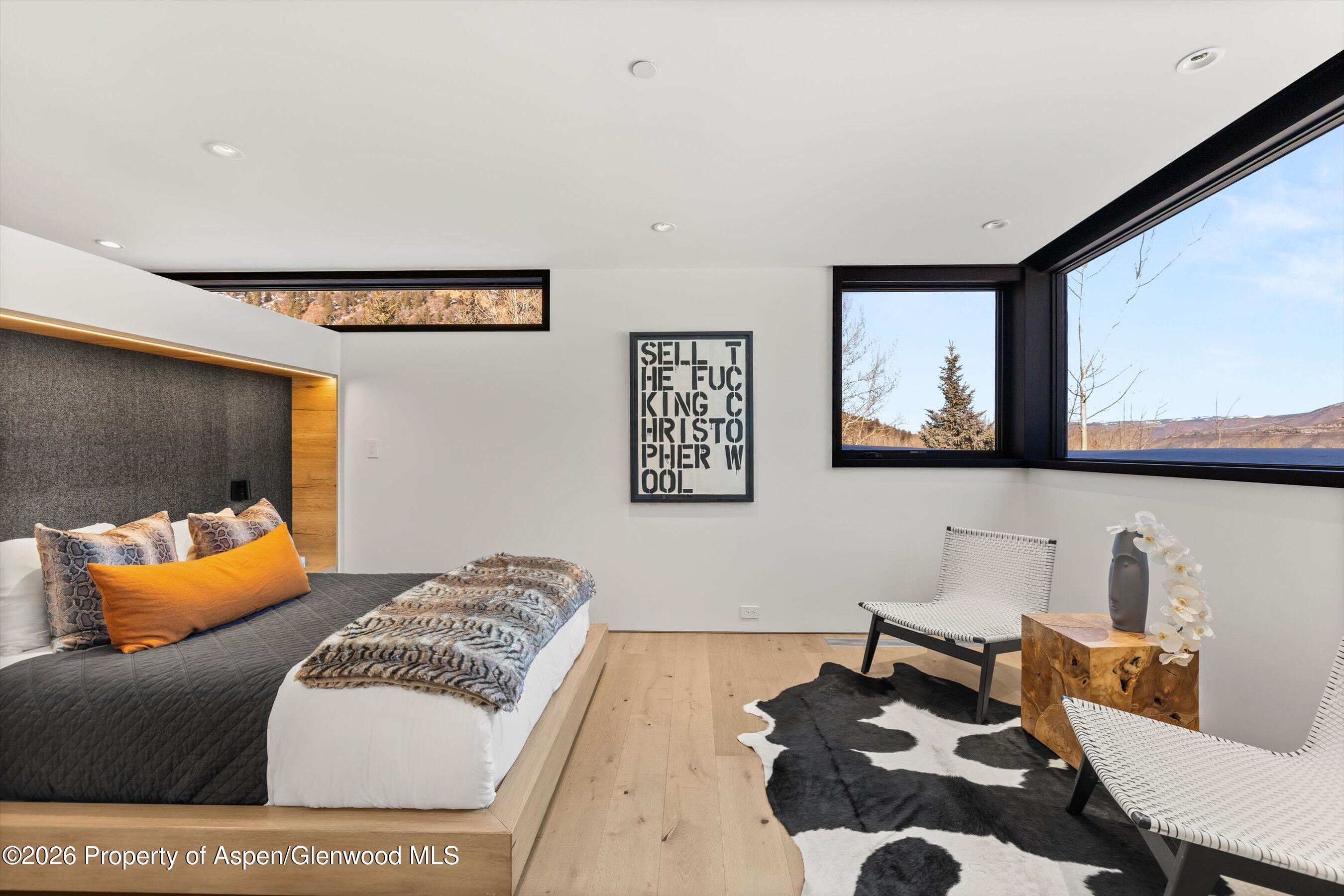 296 Glen Dee Road Aspen, CO 81611 - Photo 34 of 59 a living room with furniture and painting on the wall