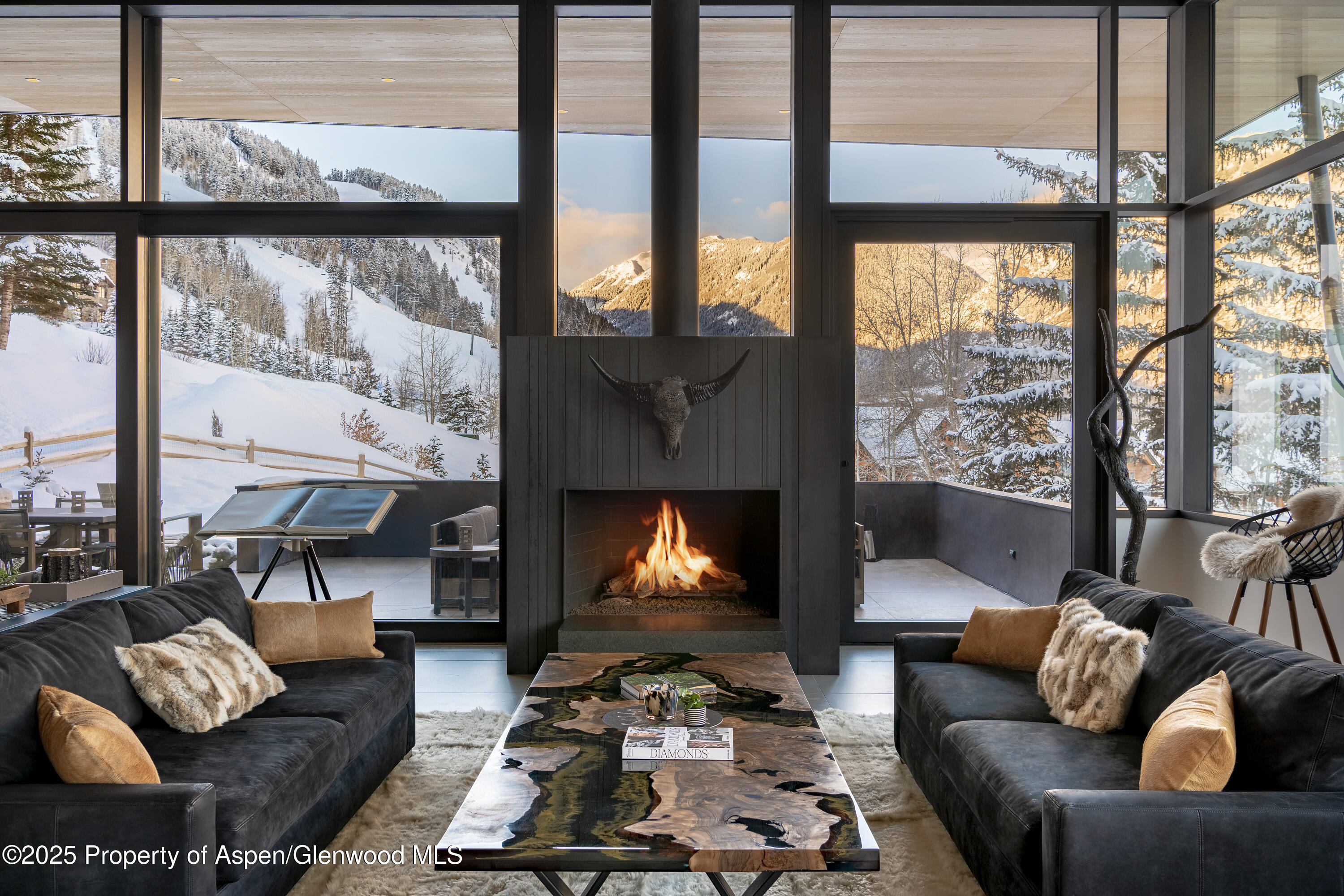 296 Glen Dee Road Aspen, CO 81611 - Photo 4 of 25 a living room with furniture and a fireplace