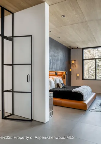 a bedroom with furniture and a window