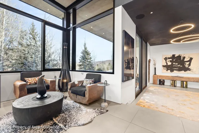 a room with gym equipment and view of living room