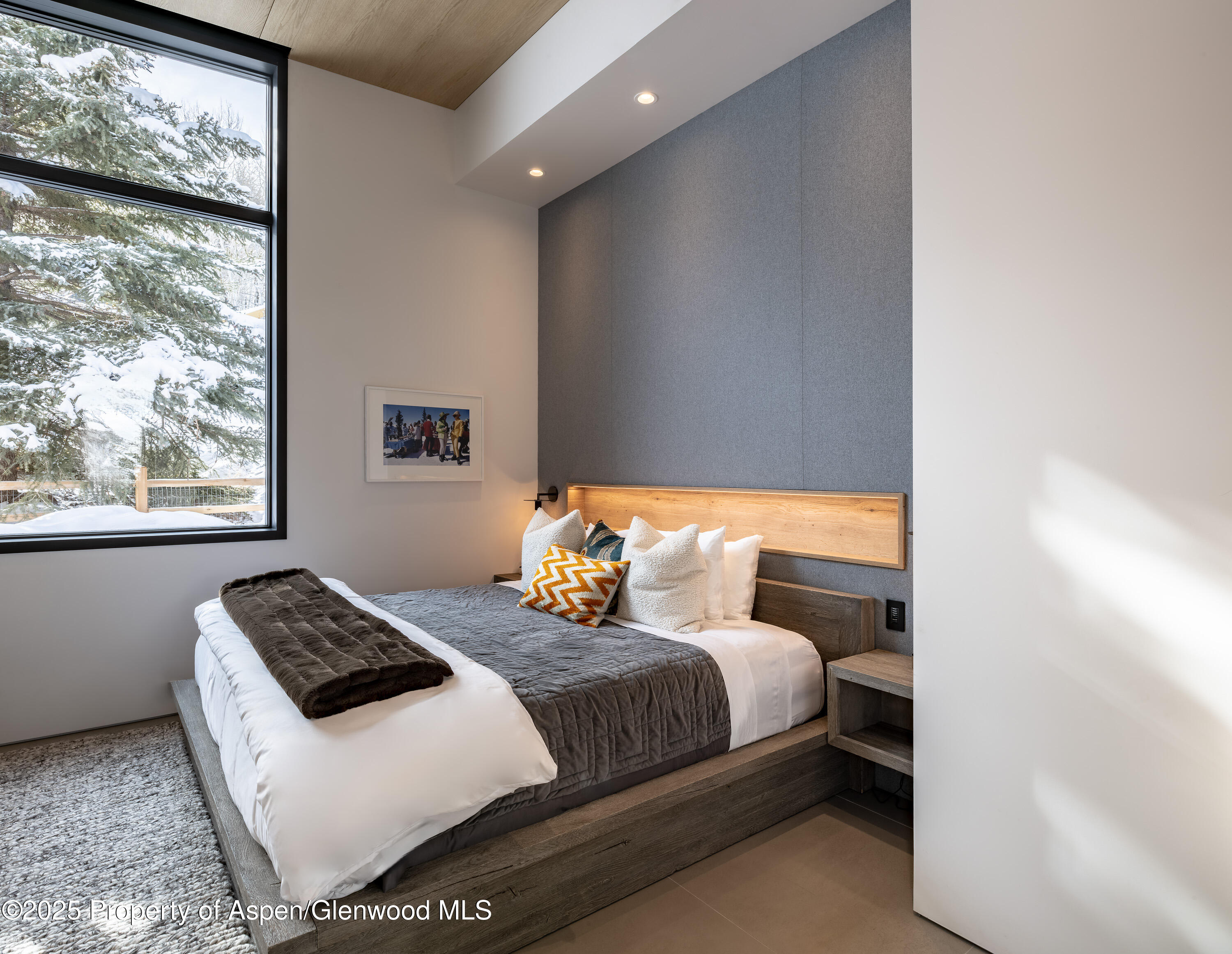 296 Glen Dee Road Aspen, CO 81611 - Photo 9 of 25 a bedroom with a bed and window