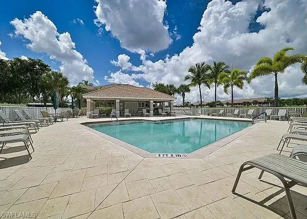 a view of a swimming pool with a patio