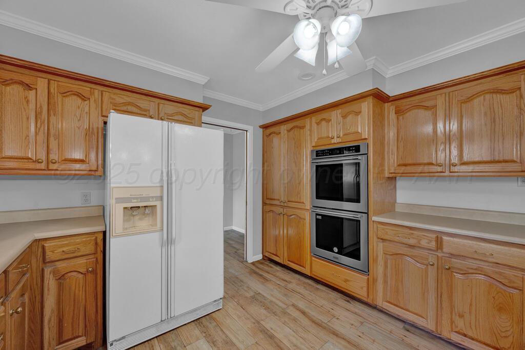 4231 Camp Lane Amarillo, TX 79110 - Photo 12 of 36 a kitchen with stainless steel appliances granite countertop a refrigerator and a stove top oven