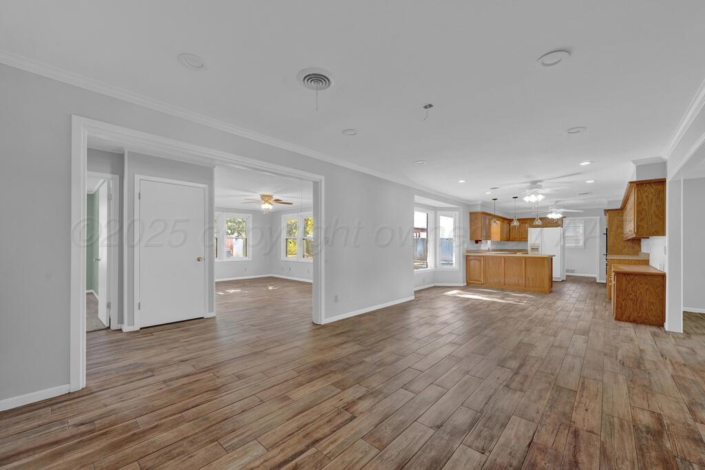 4231 Camp Lane Amarillo, TX 79110 - Photo 13 of 36 a view of a livingroom with wooden floor