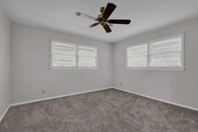 a room with window and ceiling fan