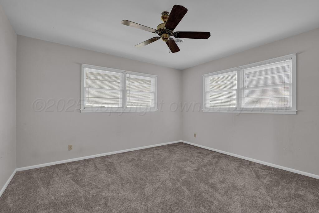 4231 Camp Lane Amarillo, TX 79110 - Photo 24 of 36 a room with window and ceiling fan
