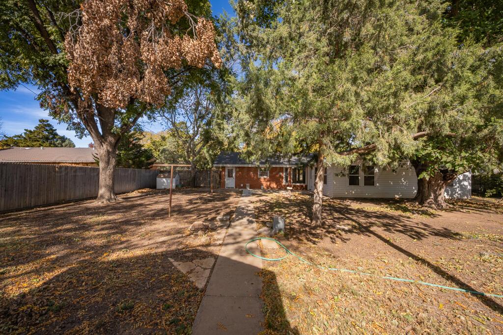 4231 Camp Lane Amarillo, TX 79110 - Photo 31 of 36 a view of a backyard with a tree