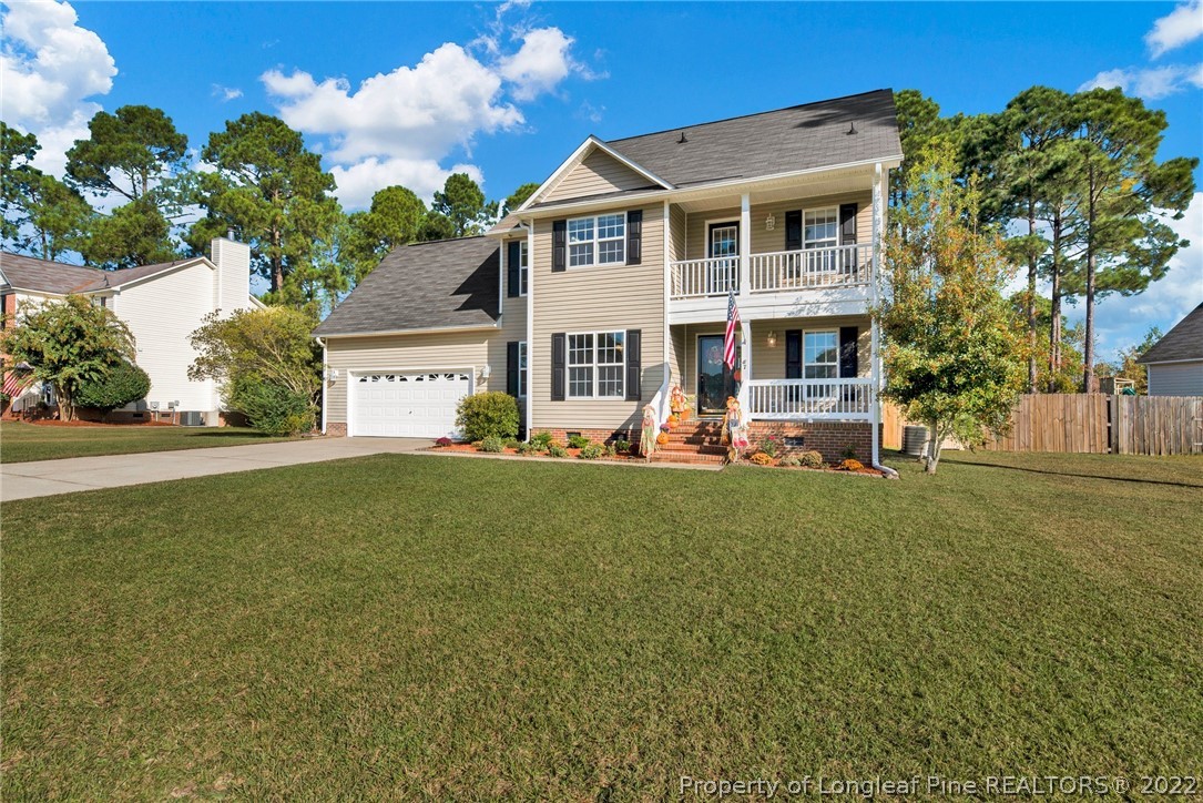 67 Chesapeake Road Cameron, NC 28326 - Photo 3 of 40 a front view of a house with a yard