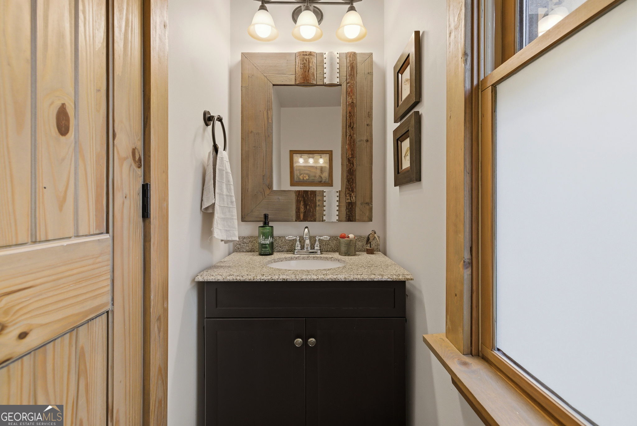 634 Little Hawk Road Sautee Nacoochee, GA 30571 - Photo 16 of 54 a bathroom with a granite countertop sink and a mirror