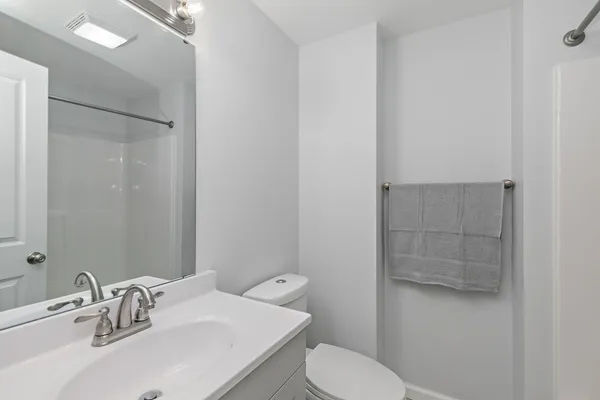 a bathroom with a sink and toilet