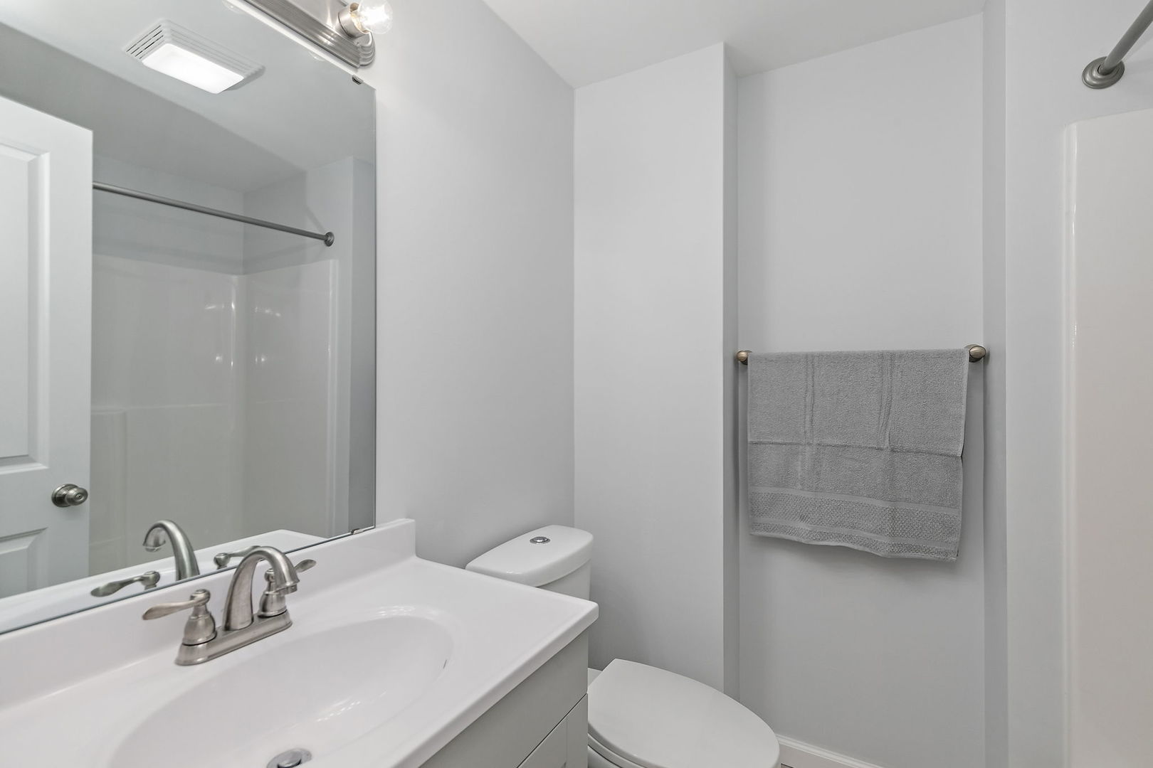 613 South 1st Street DeKalb, IL 60115 - Photo 12 of 21 a bathroom with a sink and toilet