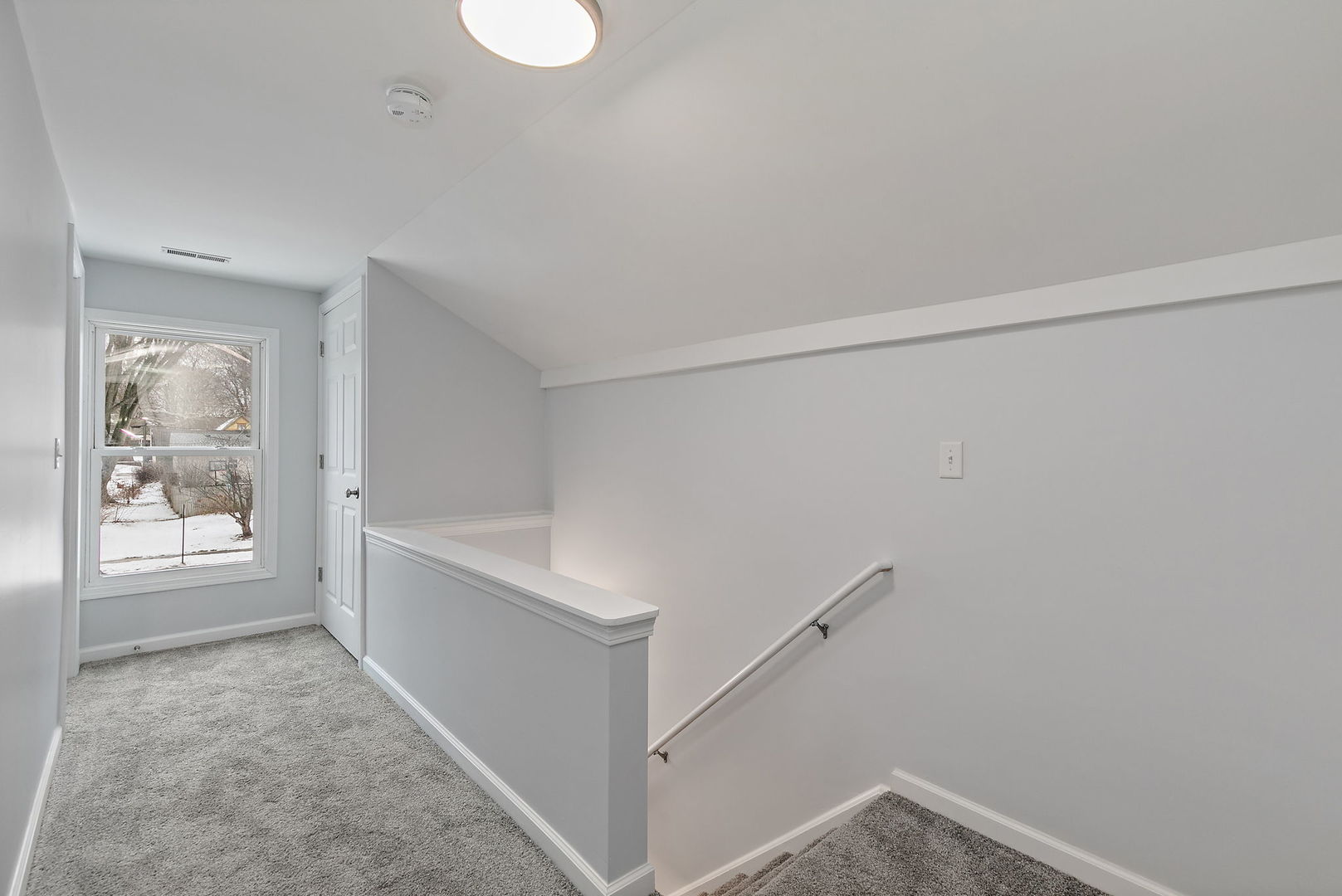 613 South 1st Street DeKalb, IL 60115 - Photo 13 of 21 a view of an empty room and window