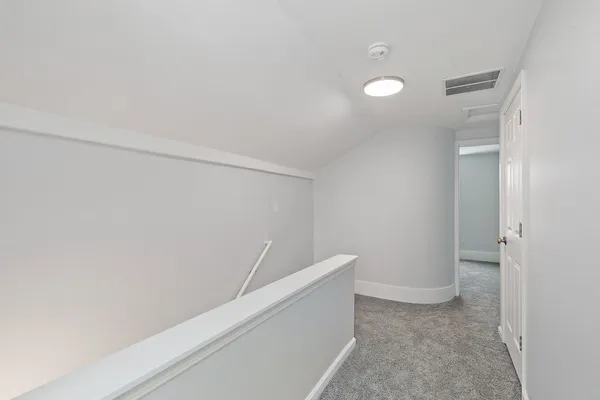 a view of storage and utility room with racks on the wall