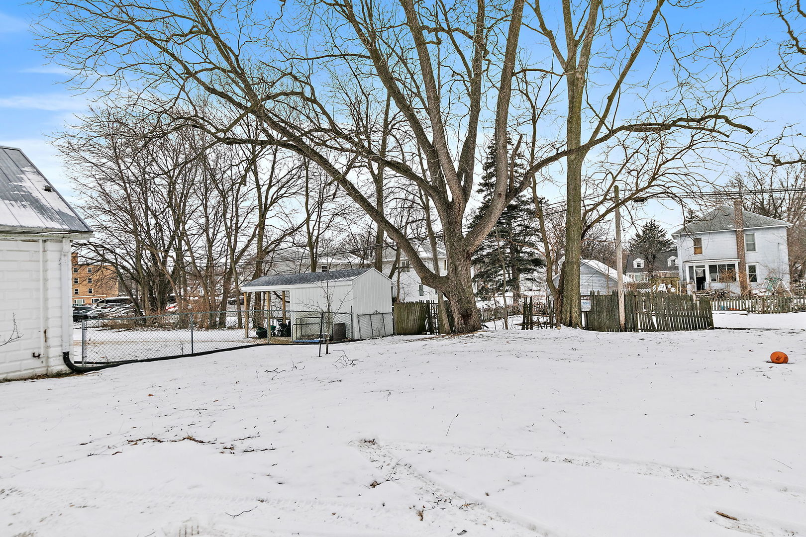 613 South 1st Street DeKalb, IL 60115 - Photo 21 of 21 a street view covered with snow