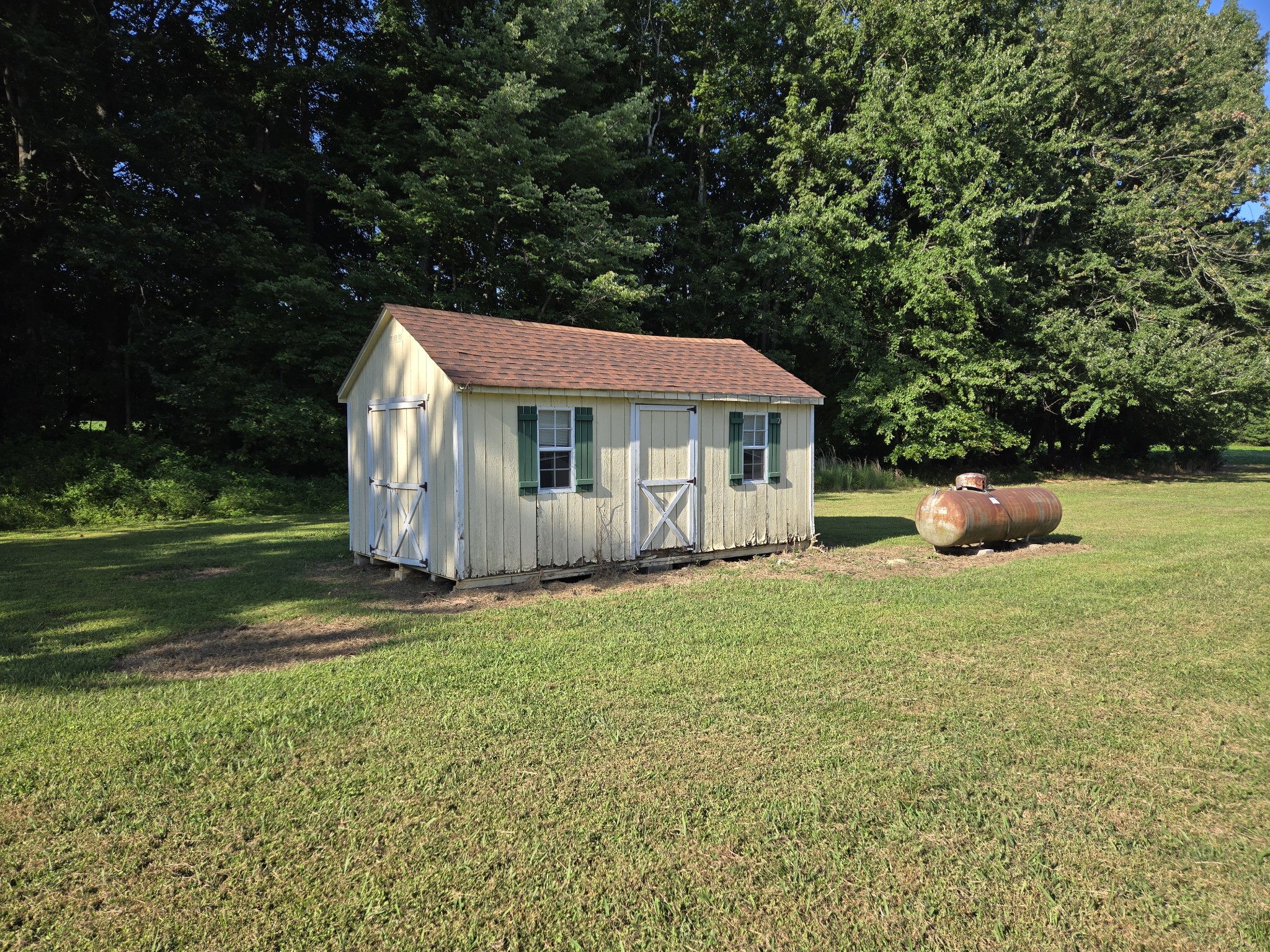 2550 Friendship Road Cross Plains, TN 37049 - Photo 3 of 4 a front view of a house with a garden
