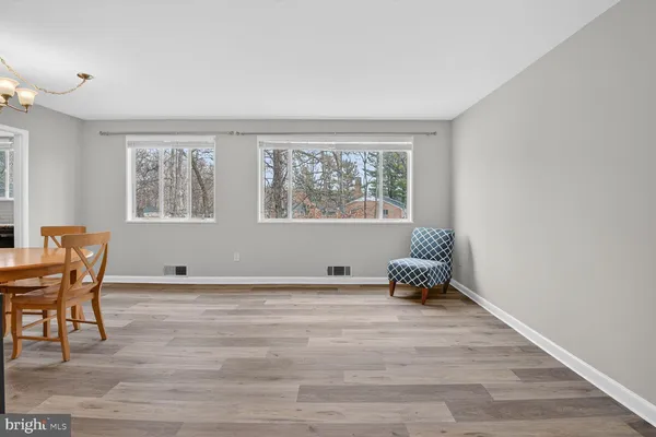 a room with a window and wooden floor