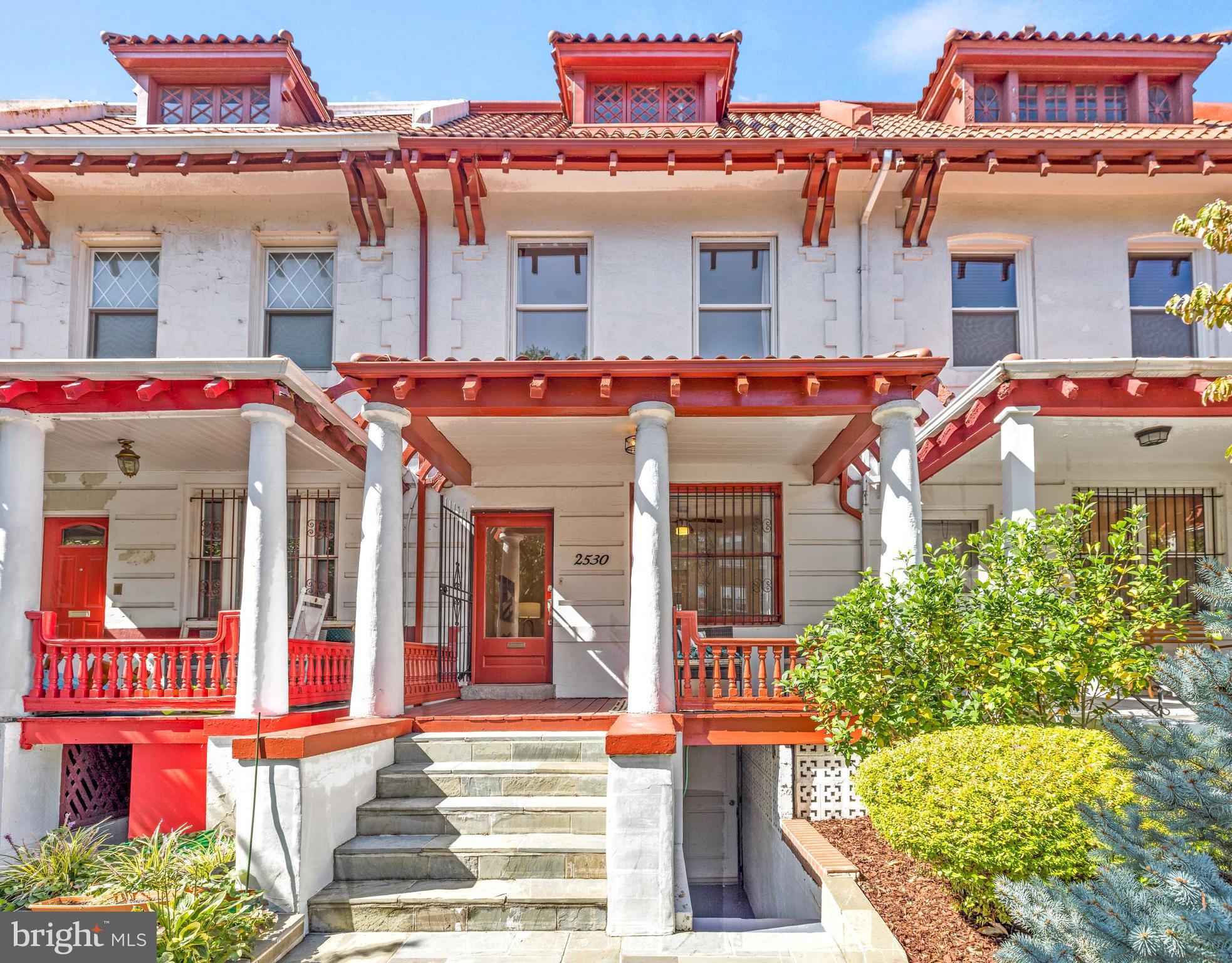 a front view of a multi story building with an entrance