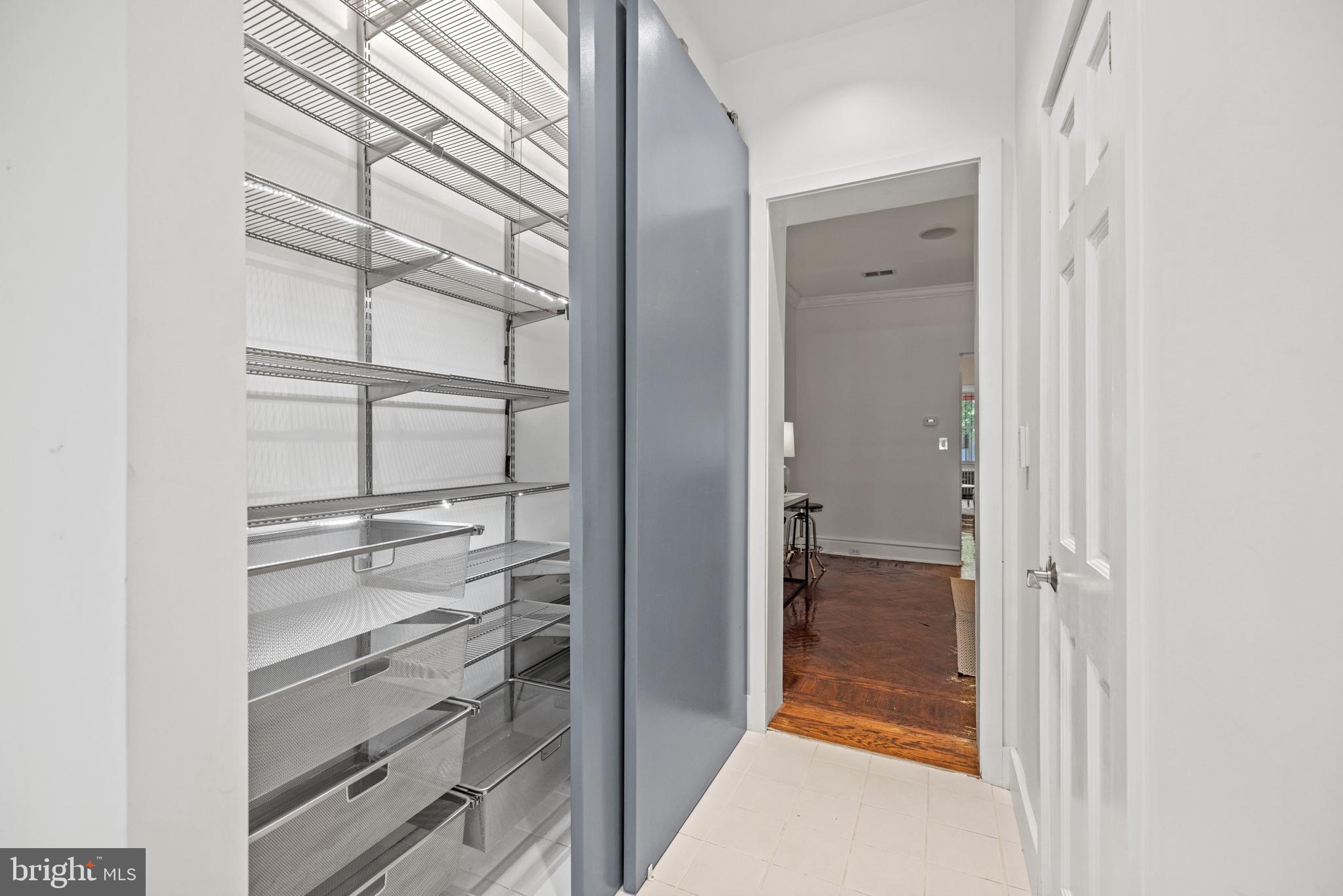 2530 13th Street Northwest Washington, DC 20009 - Photo 11 of 33 a view of walk in closet with empty racks