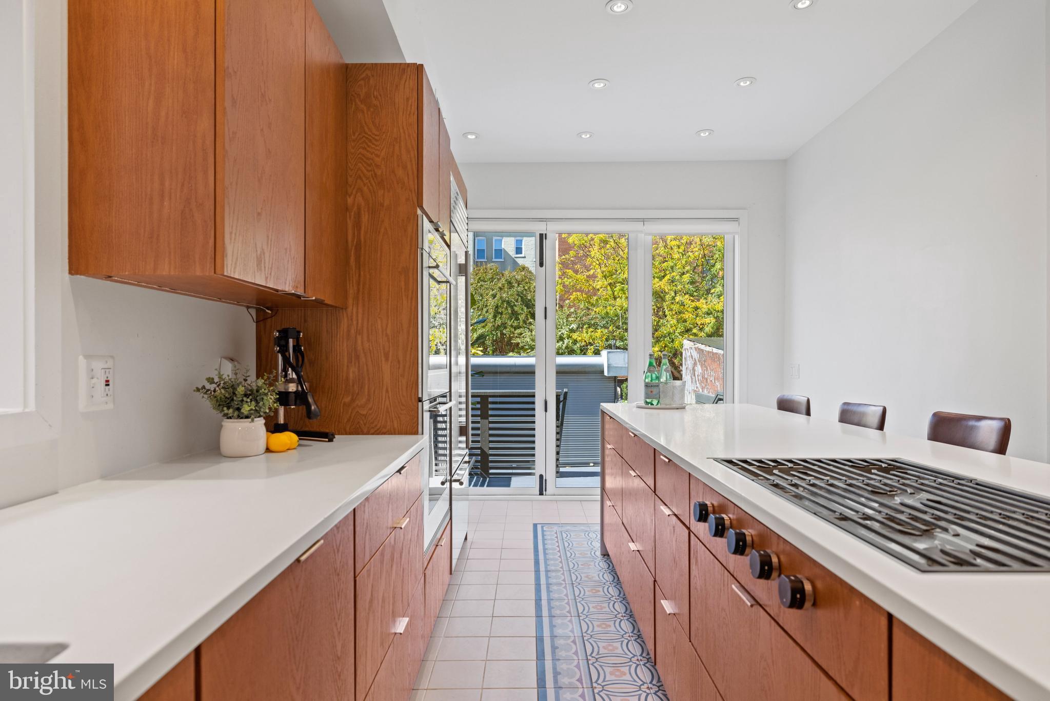 2530 13th Street Northwest Washington, DC 20009 - Photo 13 of 33 a kitchen with a sink stove and cabinets