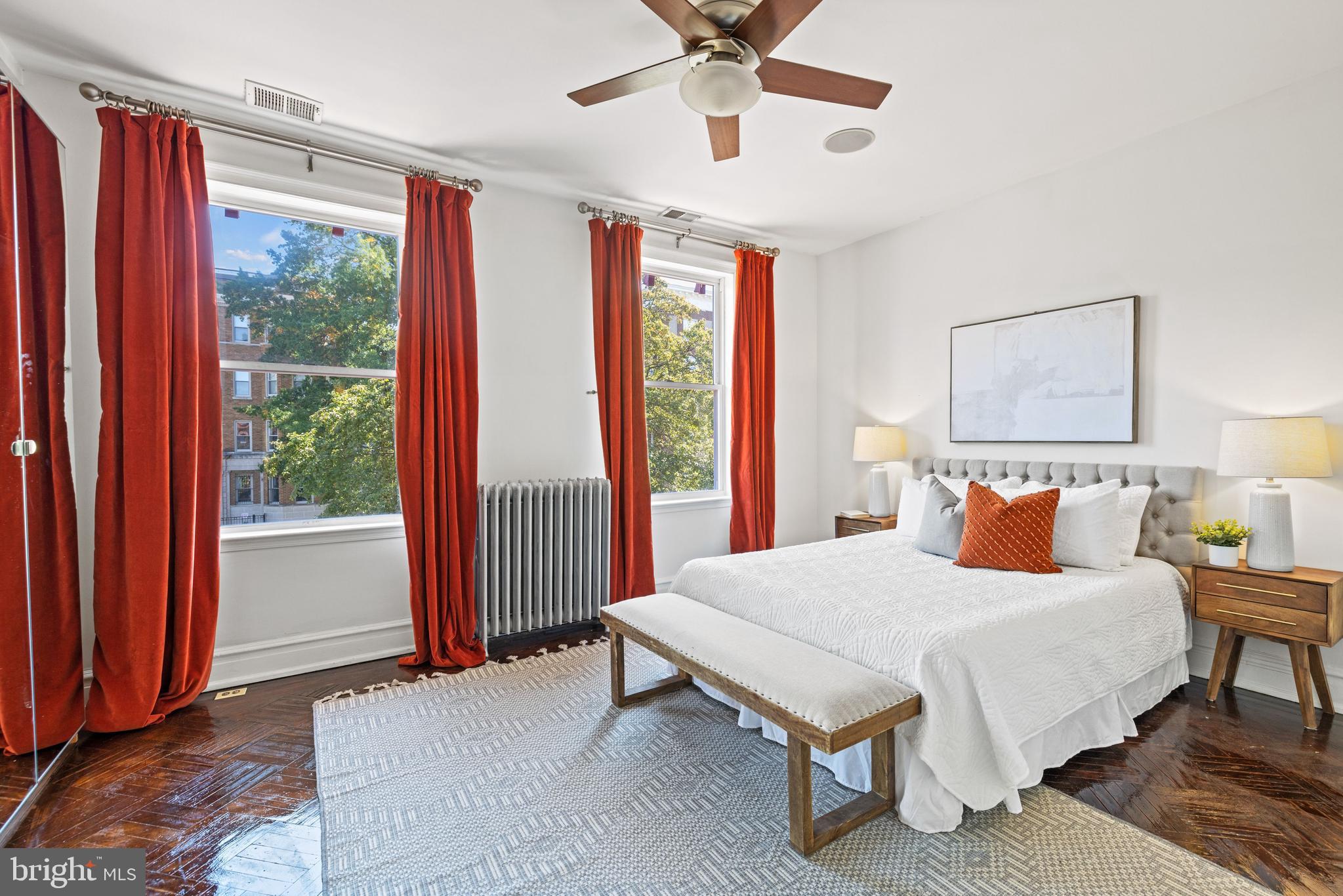 2530 13th Street Northwest Washington, DC 20009 - Photo 17 of 33 a bedroom with a bed and a large window