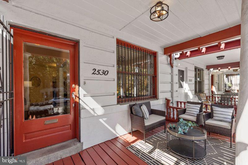 2530 13th Street Northwest Washington, DC 20009 - Photo 2 of 33 a living room with furniture and a window