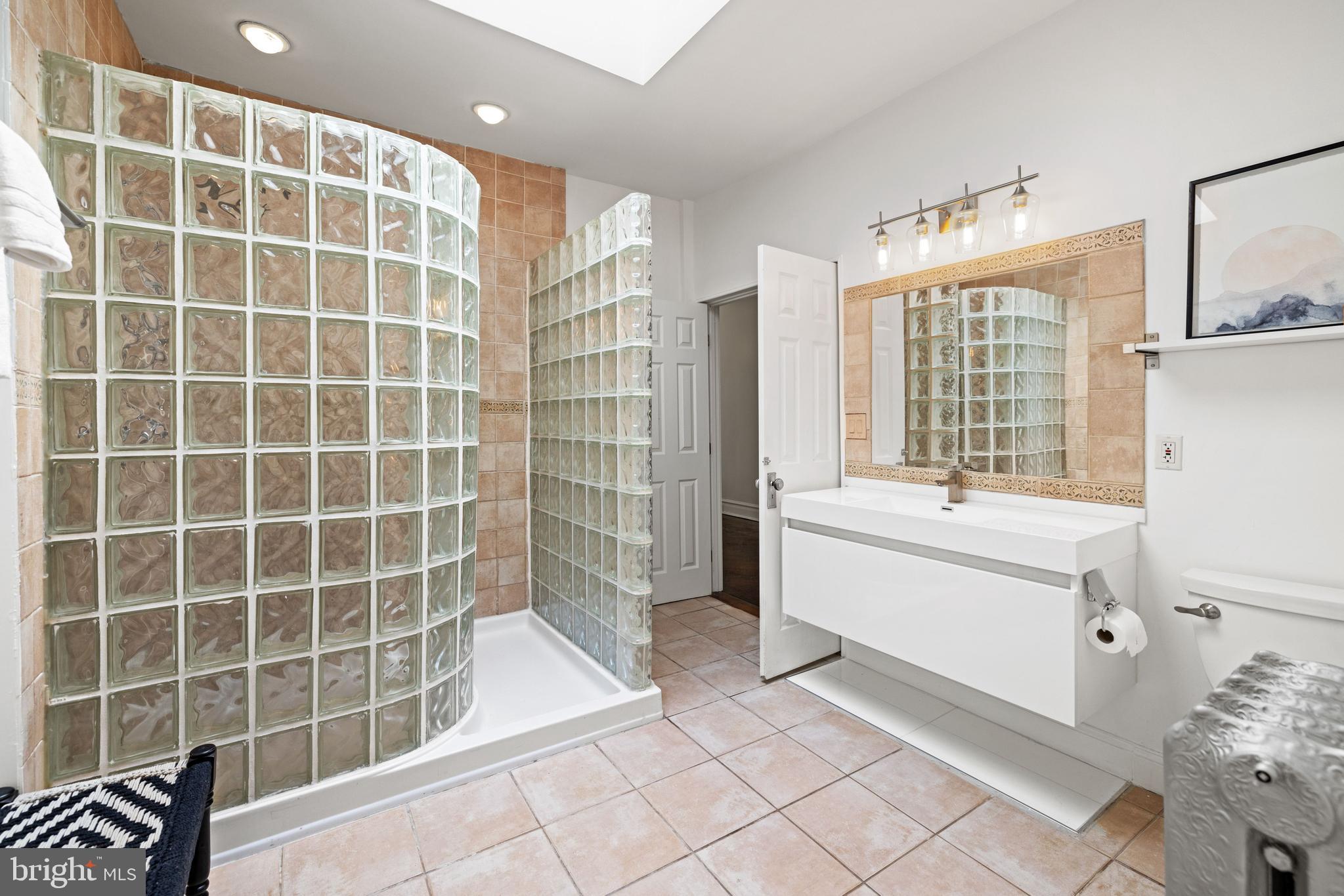 2530 13th Street Northwest Washington, DC 20009 - Photo 21 of 33 a bathroom with a bathtub sink and mirror