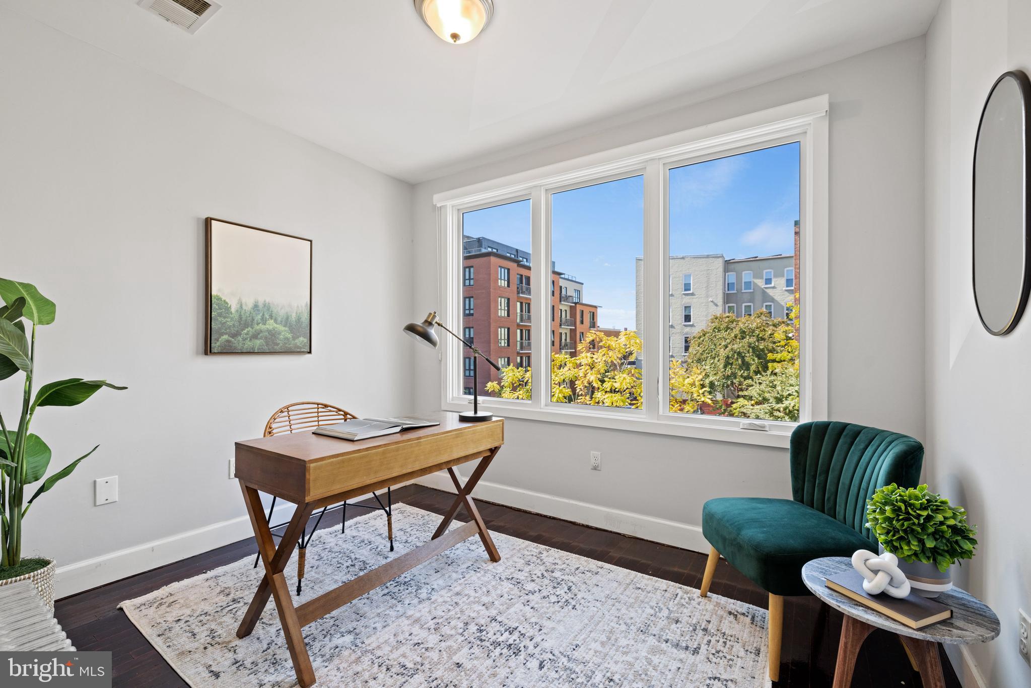 2530 13th Street Northwest Washington, DC 20009 - Photo 24 of 33 a living room with furniture and a window