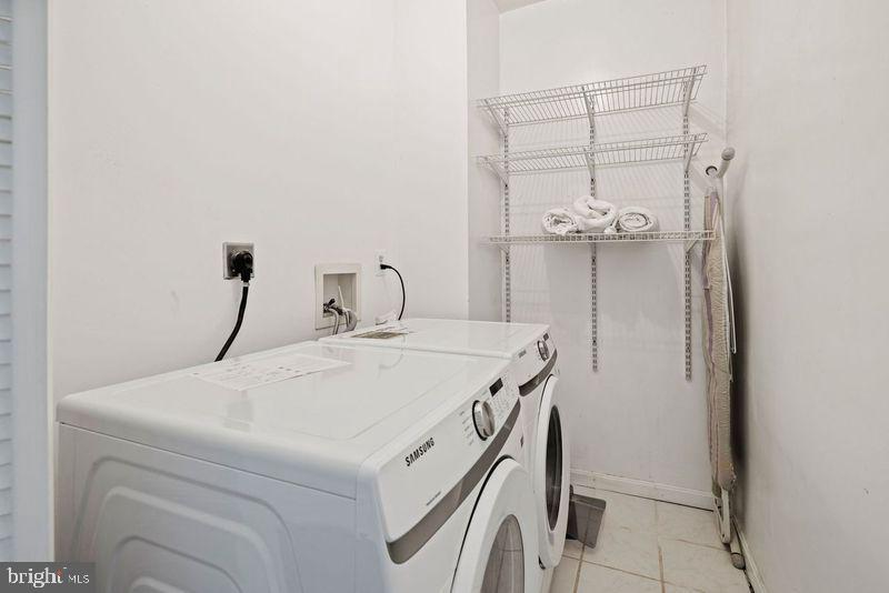 2530 13th Street Northwest Washington, DC 20009 - Photo 25 of 33 a room with a table and chandelier