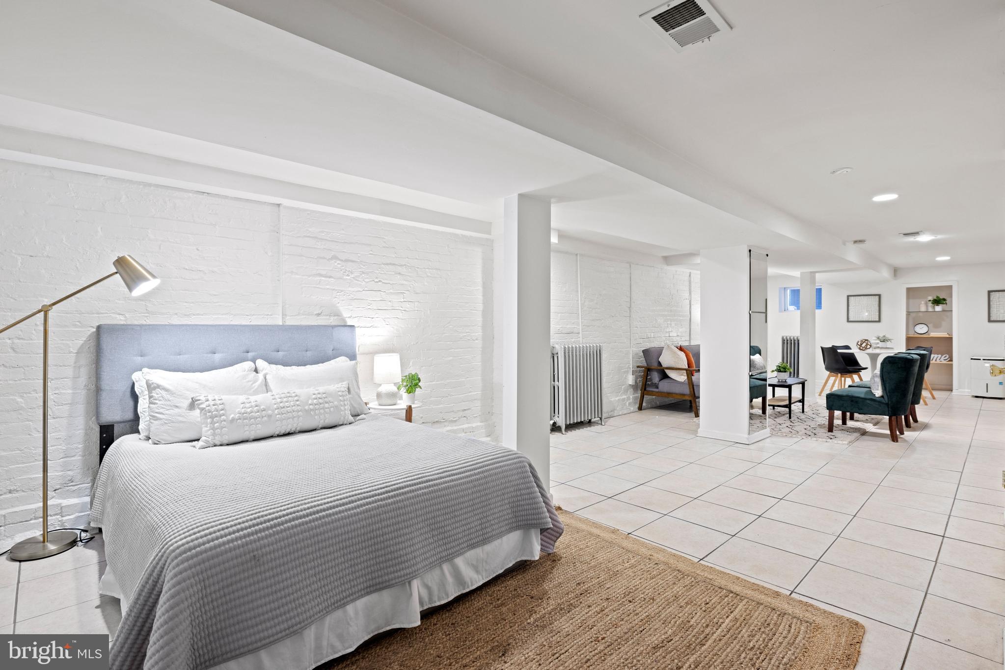 2530 13th Street Northwest Washington, DC 20009 - Photo 26 of 33 a bed room with a bed and furniture