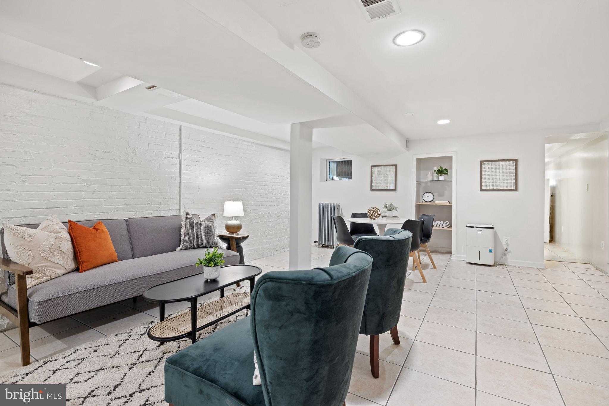 2530 13th Street Northwest Washington, DC 20009 - Photo 28 of 33 a living room with furniture and wooden floor