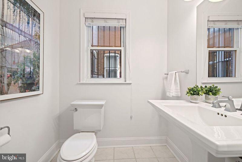2530 13th Street Northwest Washington, DC 20009 - Photo 10 of 33 a bathroom with a sink a toilet and shower