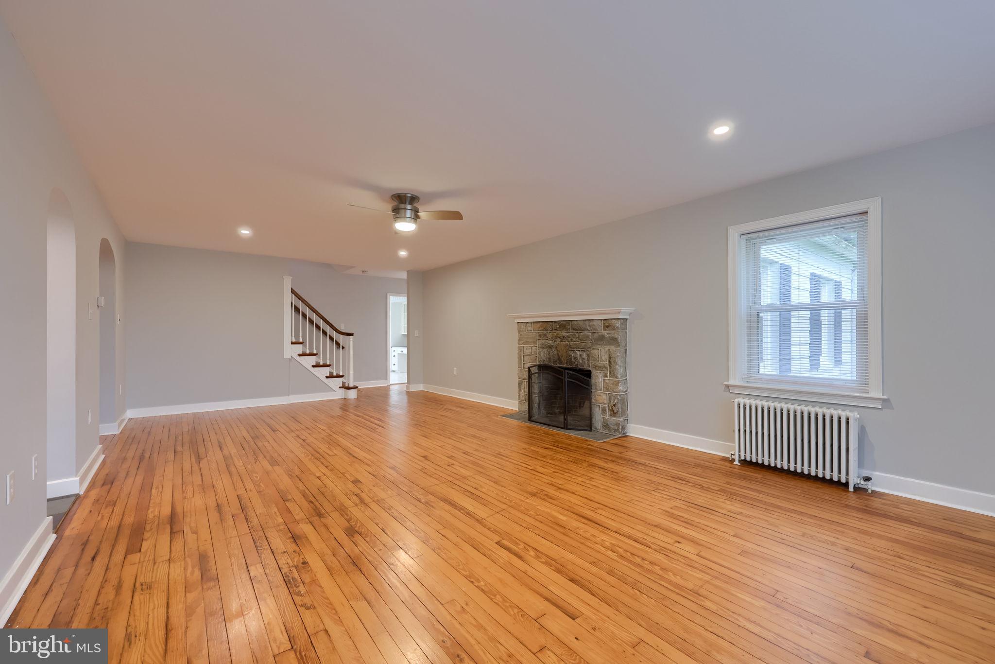 145 Weaver Road Lancaster, PA 17603 - Photo 32 of 87 a view of empty room with wooden floor and fireplace