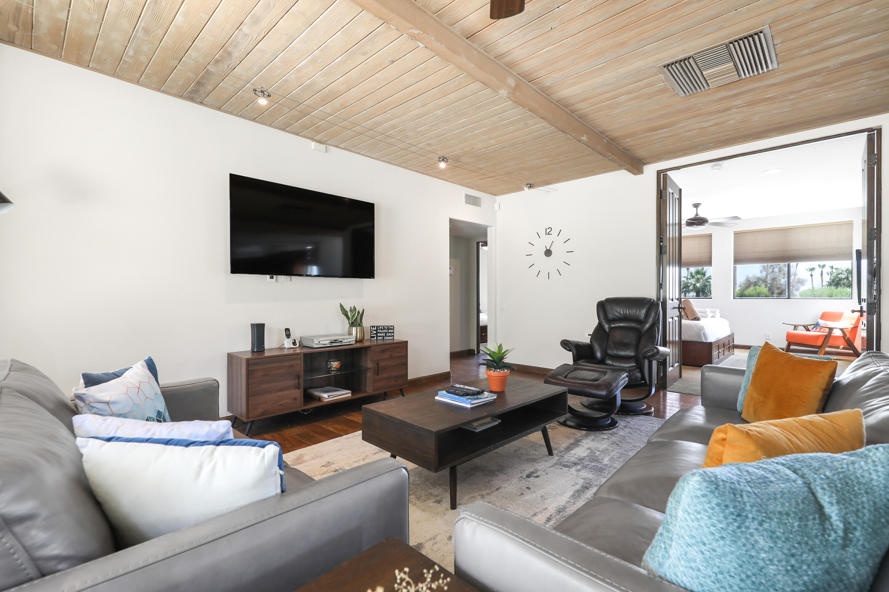 71345 Halgar Road Rancho Mirage, CA 92270 - Photo 8 of 32 a living room with furniture and a flat screen tv