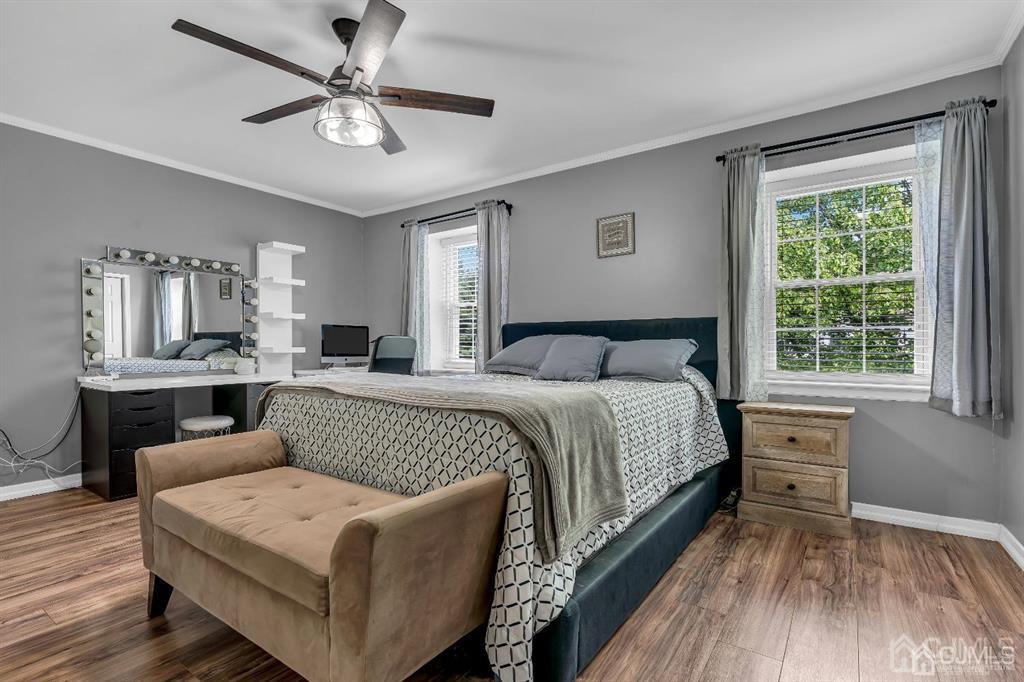 21 Bramble Lane Old Bridge, NJ 07747 - Photo 18 of 35 a bedroom with a large bed a chandelier and window