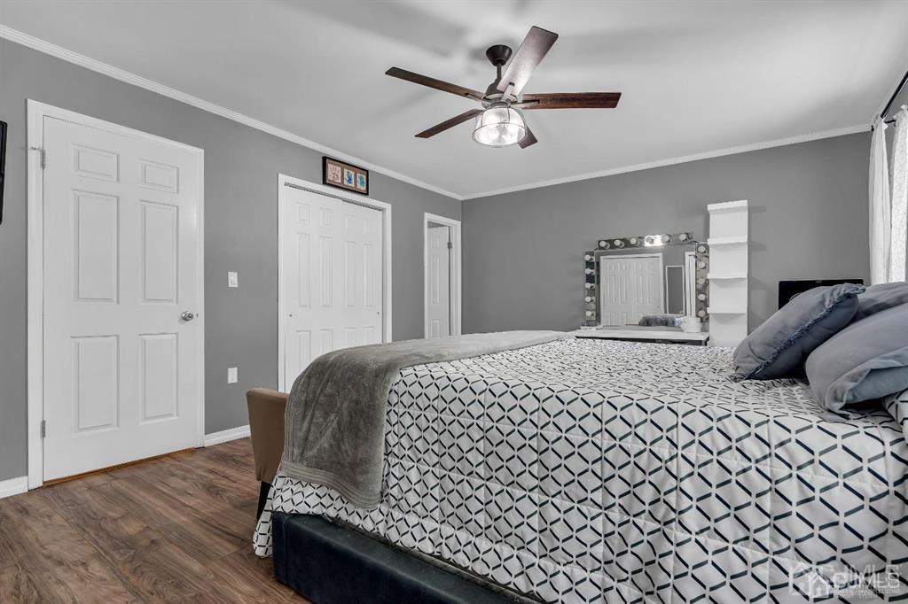 21 Bramble Lane Old Bridge, NJ 07747 - Photo 19 of 35 a bedroom with a bed and a lamp on dresser